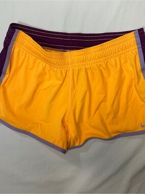 Nike Women's Yellow Athletic Shorts with Purple Trim